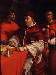 According to the lecture explanation of the painting Pope Leo X with Cardinals, what clues explain to the viewer the type of mood in the painting?