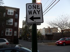 One way - gives direction of traffic on a cross street.