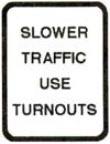 There are five vehicles following closely behind you on a road with one line in your direction: When you see this sign, you should: