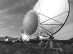 This photo shows a radio telescope that is being used in the search for life beyond Earth. How is it being used in this search?