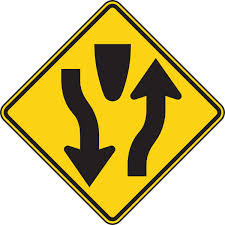 This road sign means
A. A side road is ahead
B. Stay on the right side of the roadway
C. You may drive in the left lane
D. You have the right-of-way