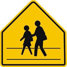 This road sign means
A. Crossing not permitted
B. Business district
C. Stay on sidewalk
D. School crossing